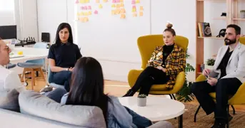 Employees Actively Listening In A Group Listing Page